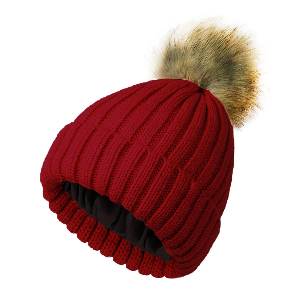 Womens Solid-Color Brimmed Beanie Hat With Satin lining and a Pom-Pom