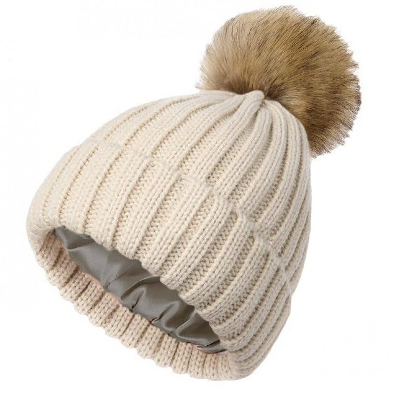 Womens Solid-Color Brimmed Beanie Hat With Satin lining and a Pom-Pom